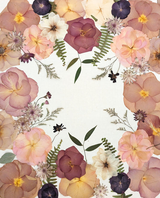 Floral arrangement on a white background with a wooden surface underneath