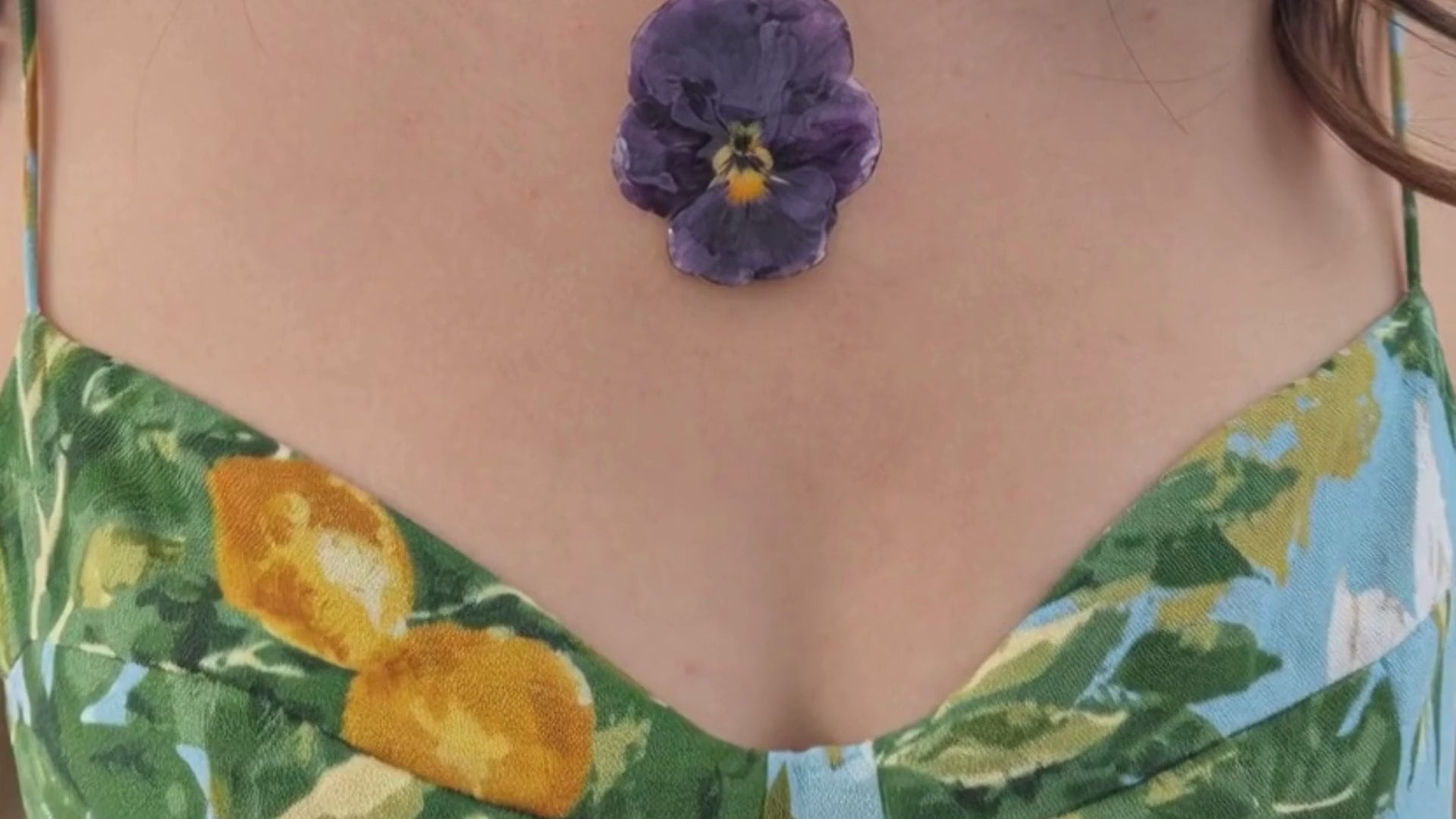 Load video: people wearing flowers, people wering resin flowers, girls wearing botanical flowers, orchid necklace, pressed flower necklace, statement necklace, statement acessories, handmade jewelry, made in usa