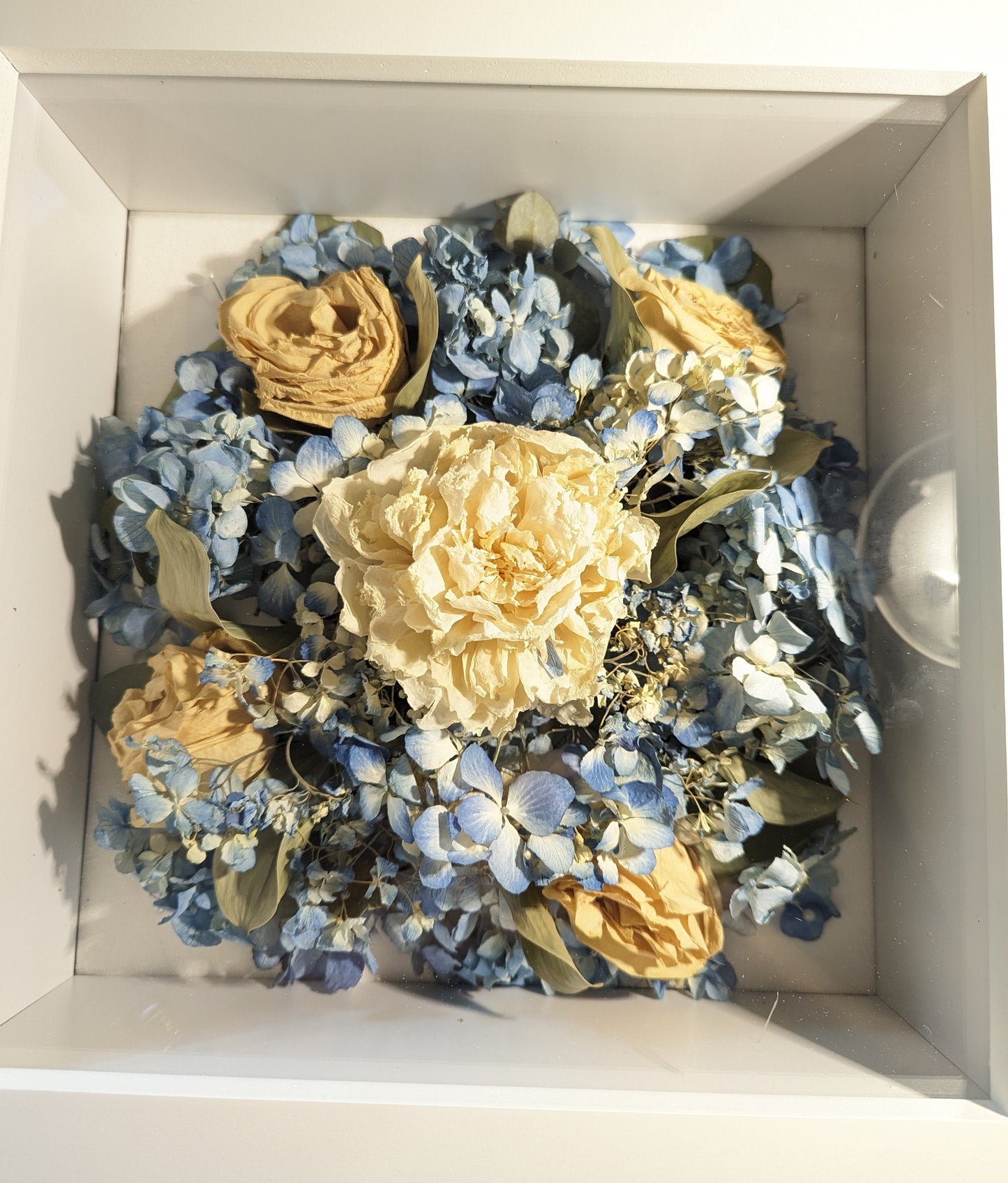 Bouquet of dried flowers in a white box